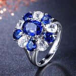 Blomster ring med blå sten